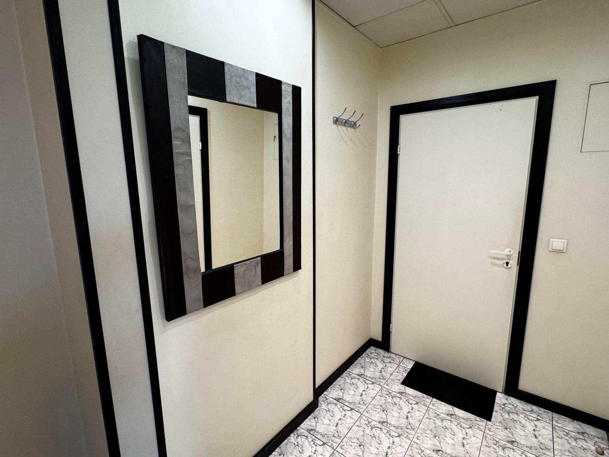 Aparthotel Rīga Exterior foto A mirror in a bathroom