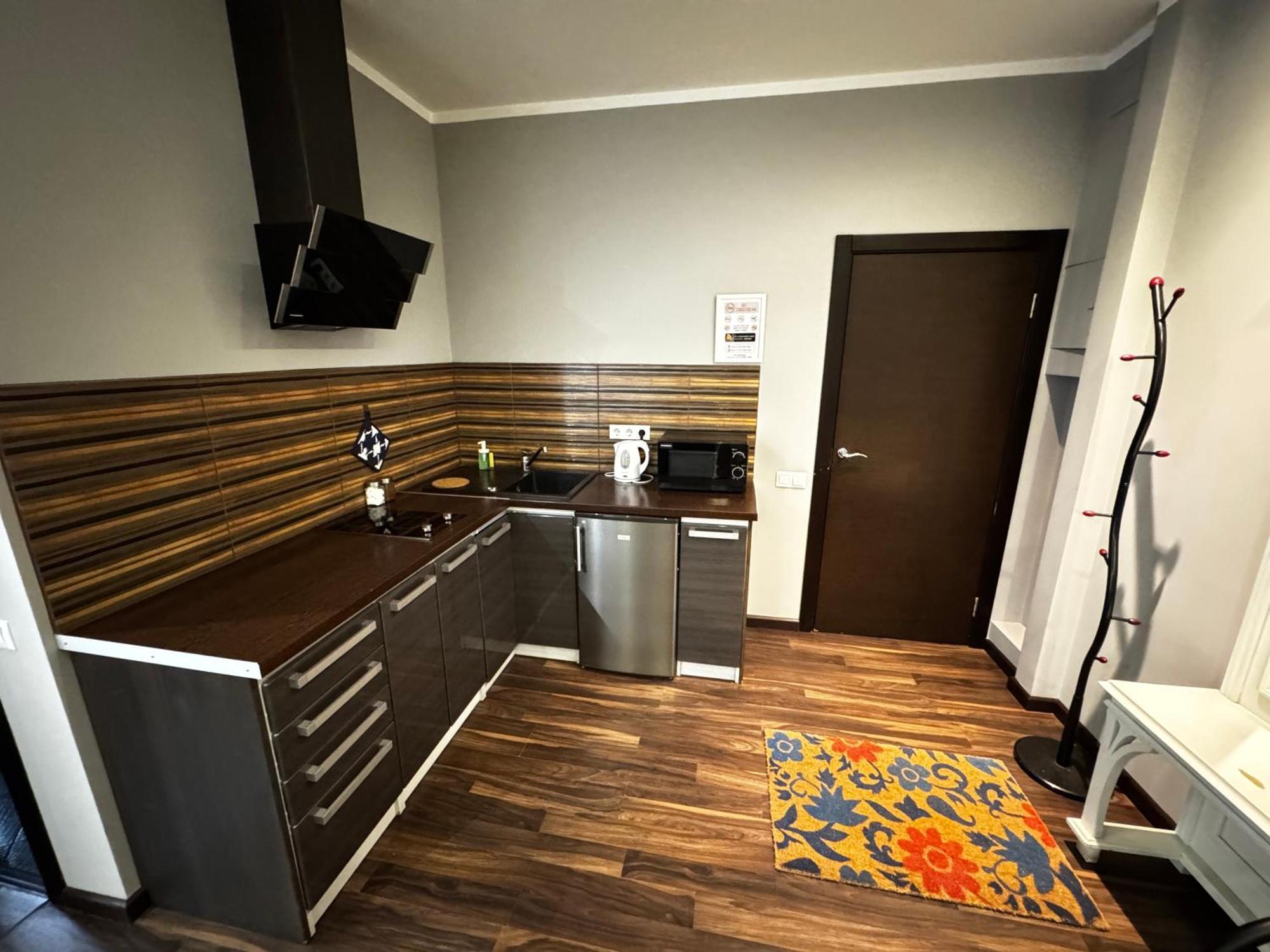 Aparthotel Rīga Exterior foto A typical kitchen in a typical apartment